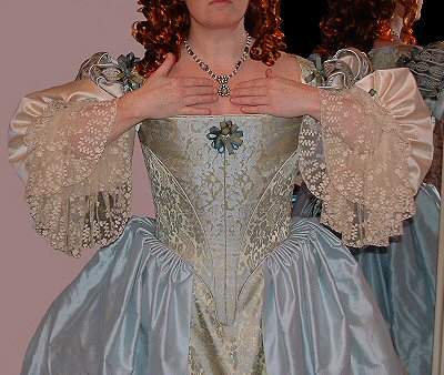 blue-gold seventeenth century period gown with lace sleeve cuffs