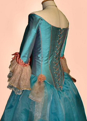 terracotta and turquoise silk period style wedding gown showing lacing of corset