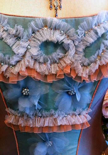pale turquoise and terracotta wedding gown with eighteenth century styling