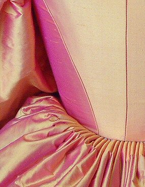 fitted pink/gold silk bodice with hand-pleated skirt