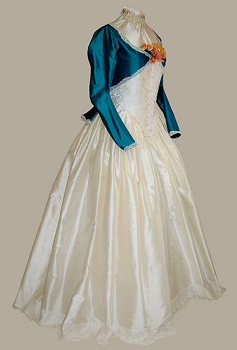 side view of nineteenth century style wedding dress in jade green with ivory silk 