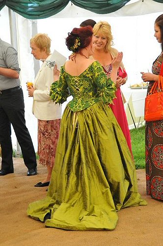 Back view ofhistorical wedding dress in gold and green