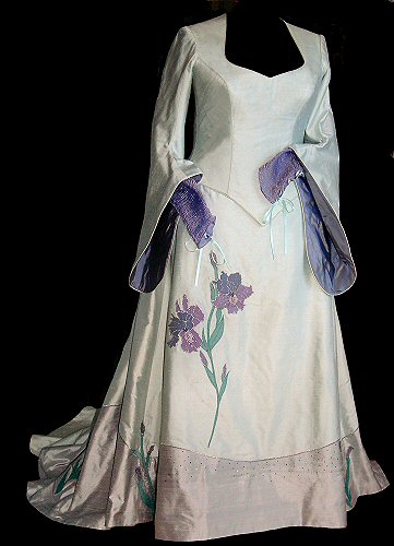 pre-raphaelite style wedding dress decorated with irises with medieval hanging sleeves