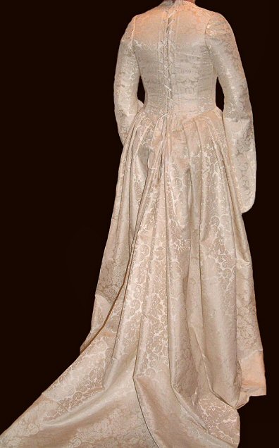ivory and gold brocade medieval style wedding dress with tailored hanging sleeves
