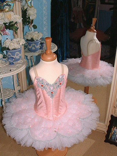 pink and white tutu shown on smallest childs stand