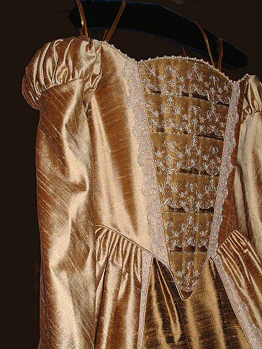 tudor-style wedding gown with layered lace stomacher