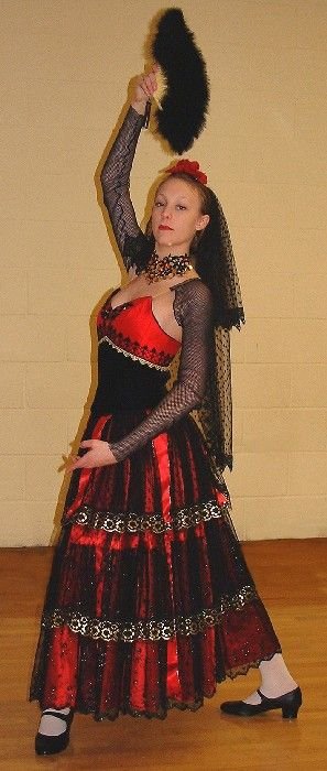 Red, gold and black Spanish Dance costume with lace, ribbons and tiered skirt; designed as a Masquerade Ball costume