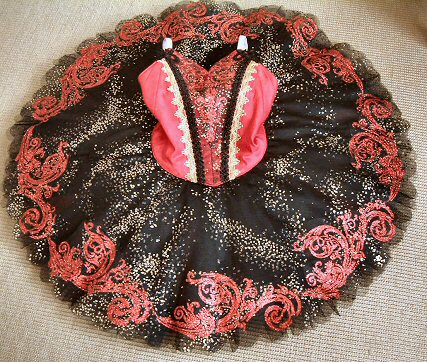 red, black and gold tutu with sparkling decoration