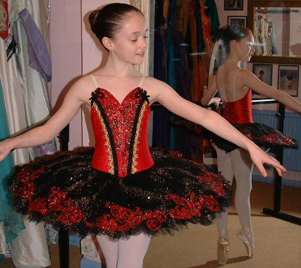 Red and black classical ballet tutu with gold decoration