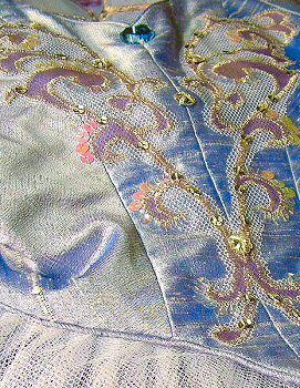 detail of tutu bodice decoration in silver appliqué and beadwork
