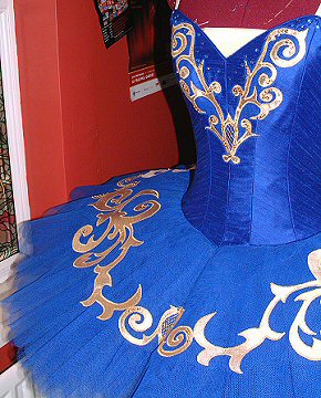 royal blue tutu decorated with gold appliqué